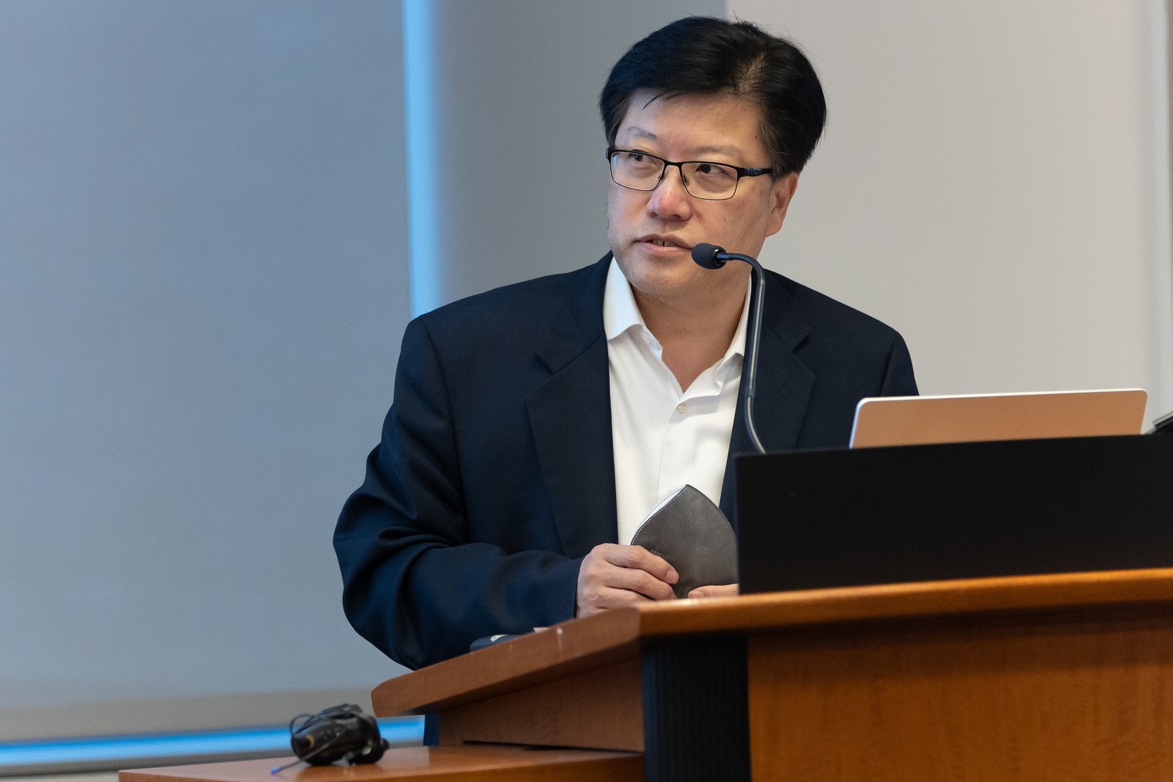 a man speaking at a podium