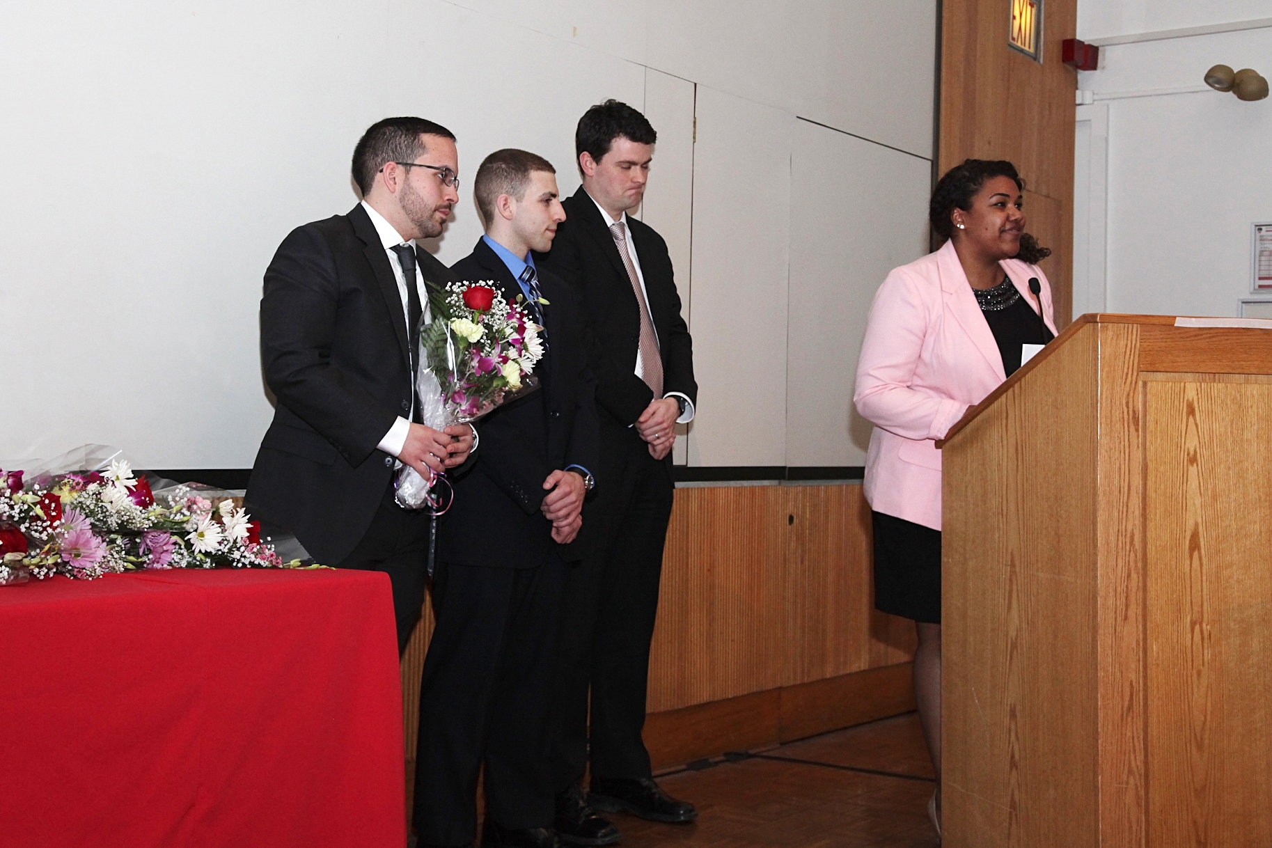 First-year student Jasmin Harpe honors those who bequeathed their bodies to science at the Gross Anatomy Memorial Service. From left, Dario Villamar, Salvatore D'Amato, Christopher Reisig, Harpe The Gross Anatomy Memorial Service; Jasmin Harpe, Dario Villamar, Salvatore D'Amato and Christopher Reisig