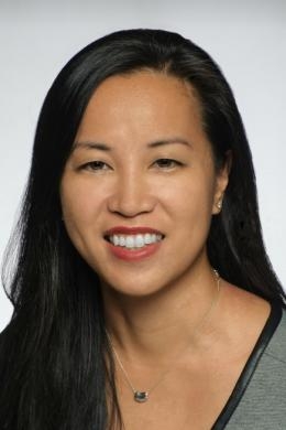 a woman smiling for a portrait