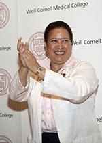 Dr. Carol Storey-Johnson applauds first-year medical students during the 2011 White Coat ceremony. Dr. Carol Storey-Johnson; 2011 White Coat ceremony