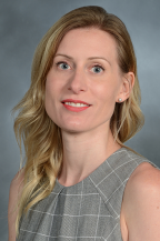 a woman smiling for a portrait