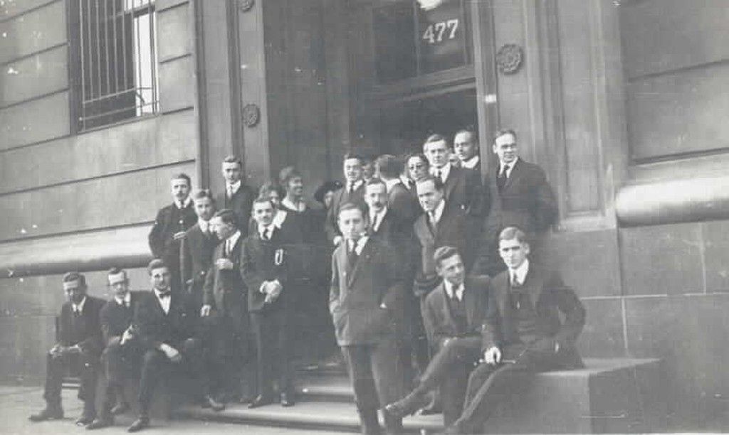 Men standing outside Cornell University in 1918