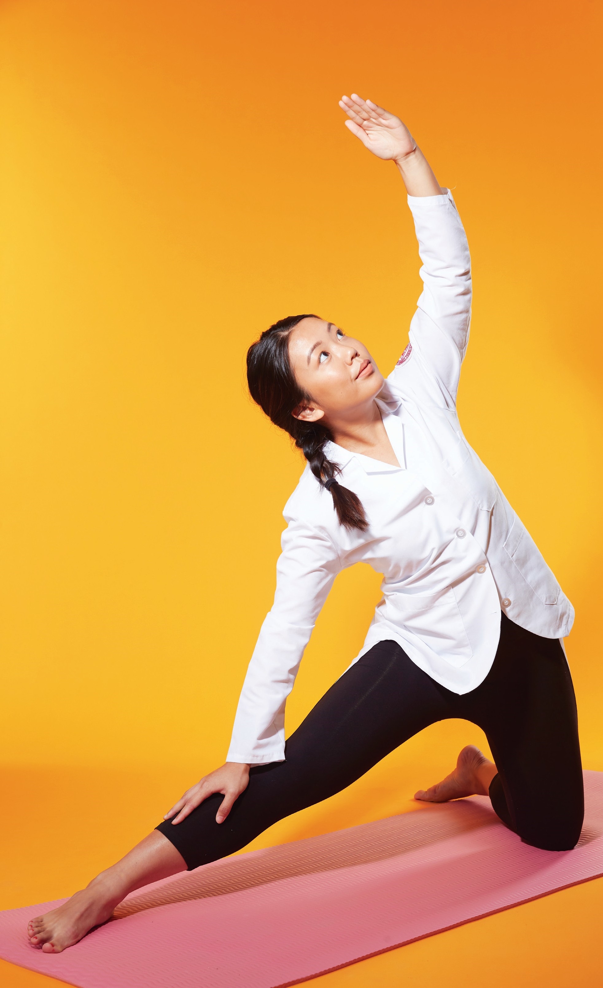 Student doing yoga. 