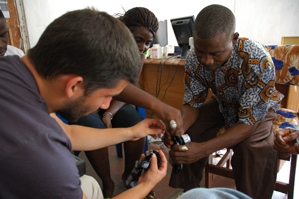 Carlo Canepa leads a training session for community health workers using solar-powered headlamps