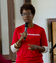 a woman giving a presentation