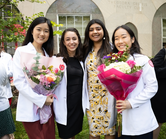 a group of physician assistant graduates posing for a photo
