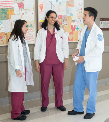 Sarita Ballakur ’21 (center) talks with urology resident Samantha Thorogood, MD (left), and Hospital for Special Surgery intern Patawut Bovonratwet, MD, between rounds and meetings during Ballakur’s trauma clerkship.
