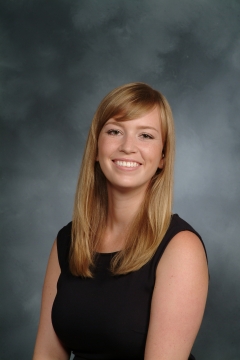 a woman smiling for a portrait