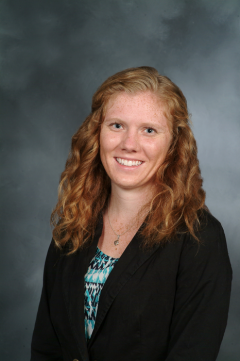 a woman smiling for a portrait