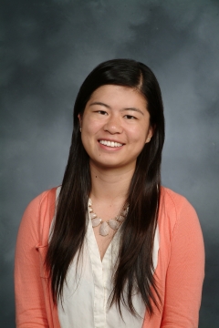 a woman smiling for a portrait