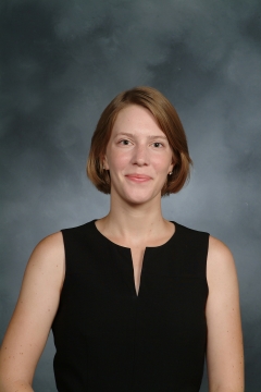 a woman smiling for a portrait