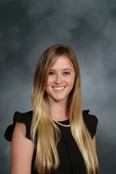 a woman smiling for a portrait