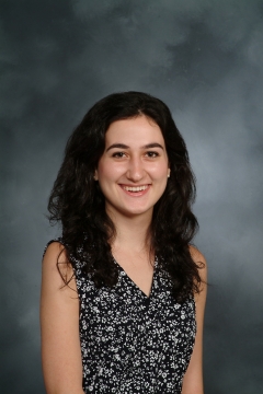 a woman smiling for a portrait