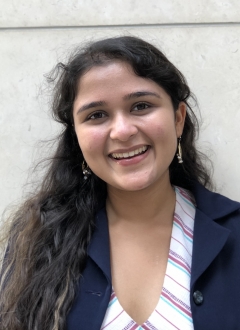 a woman smiling for a portrait