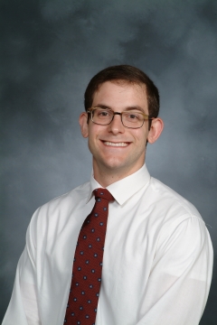 a man smiling for a portrait