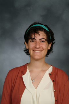 a woman smiling for a portrait