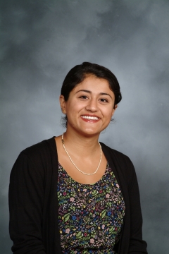 a woman smiling for a picture