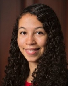 a woman smiling for a portrait