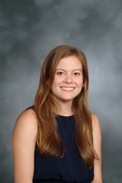 a woman smiling for a portrait