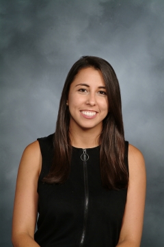 a woman smiling for a portrait