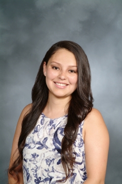 a woman smiling for a portrait