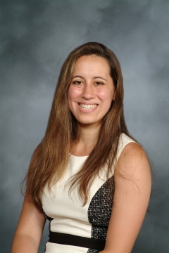 a woman smiling for a portrait