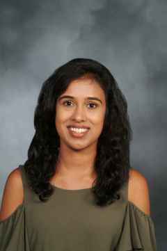 a woman smiling for a portrait