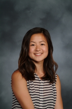 a woman smiling for a portrait