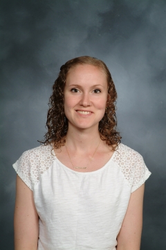 a woman smiling for a portrait