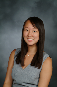 a woman smiling for a portrait